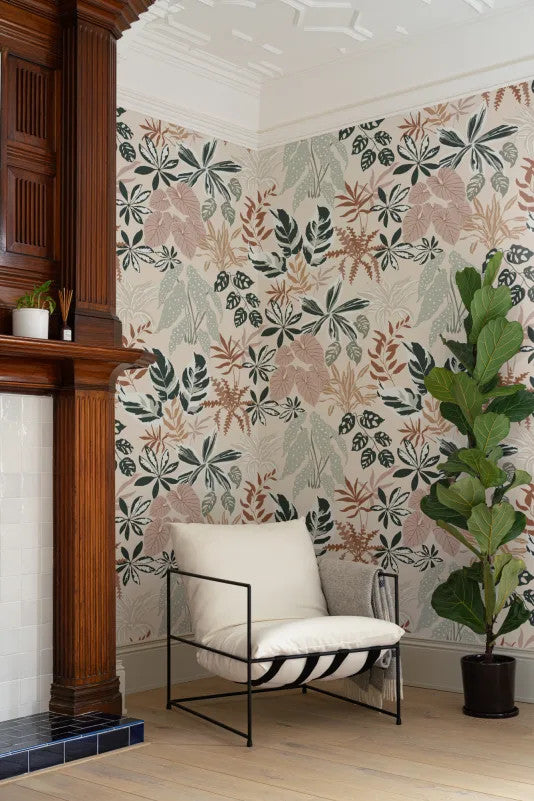 The Leafy Solarium wallpaper in warm sand and pine as a backdrop to styled furniture