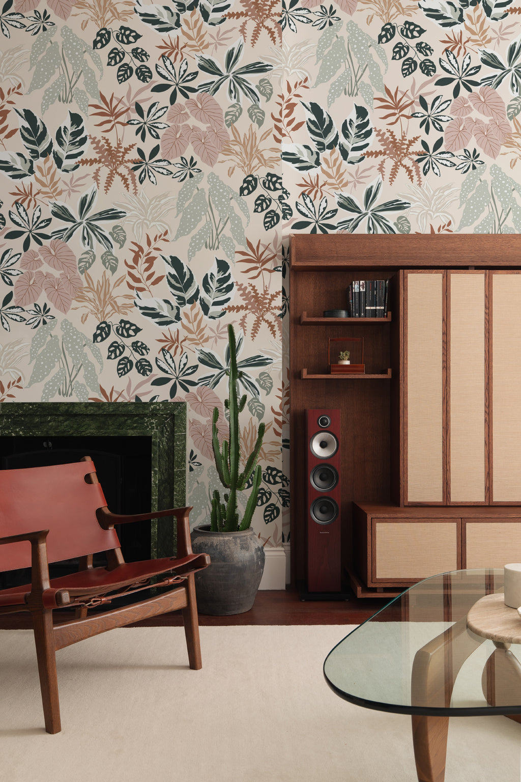 The Leafy Solarium wallpaper in warm sand and pine in a living room
