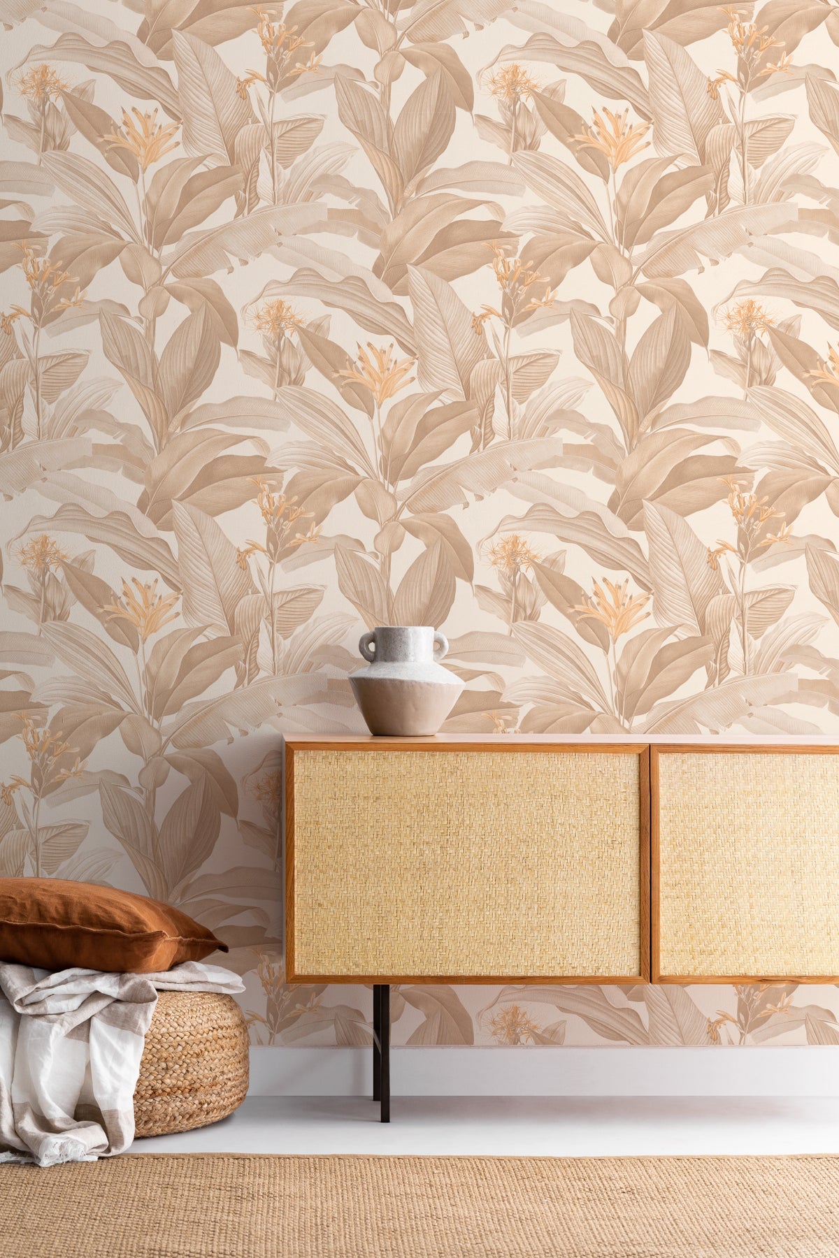 The Leafy Veranda wallpaper in sand and toffee behind a styled console
