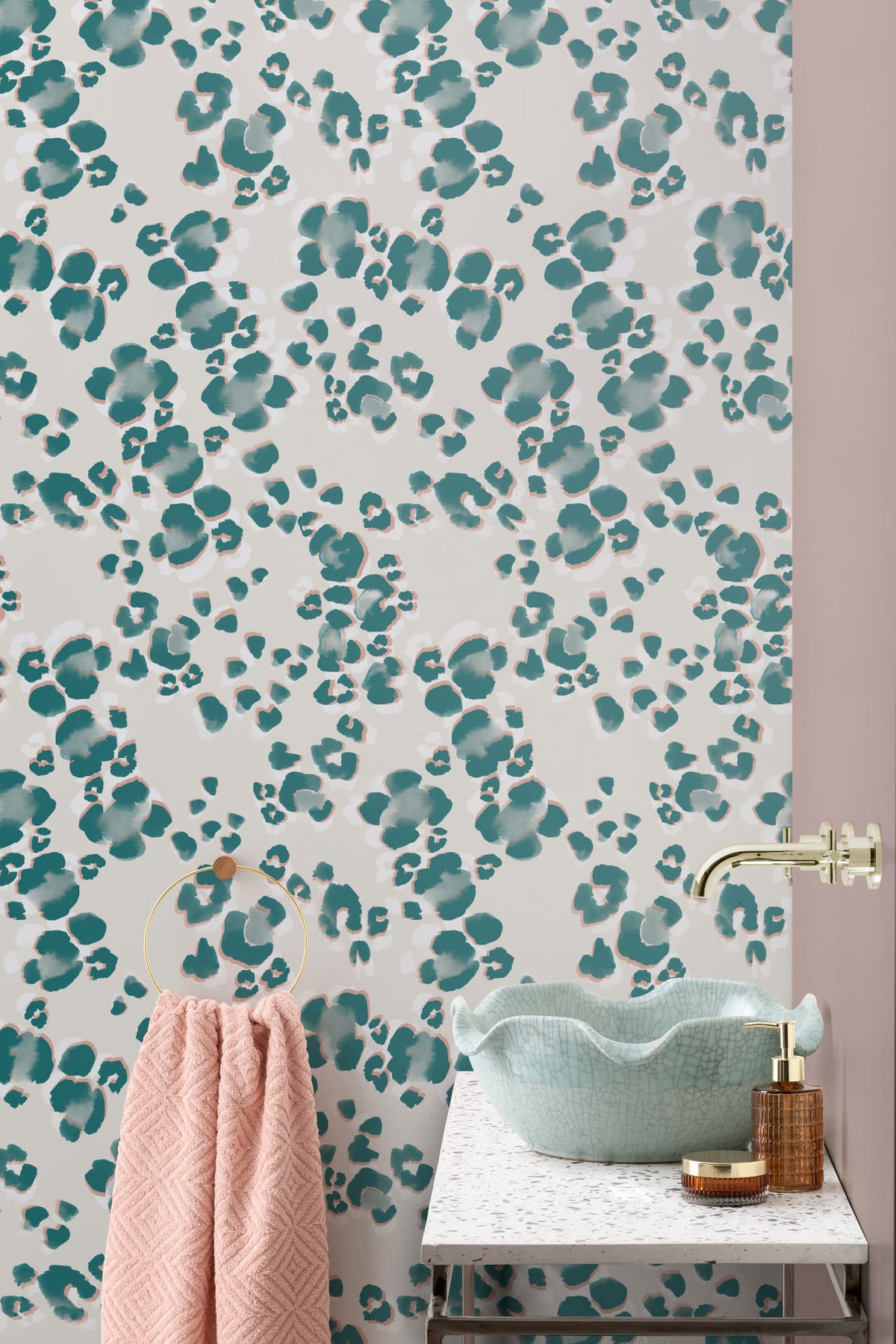 The Leopard Lounge wallpaper in teal behind a styled console