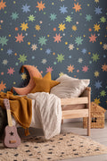 The Little Constellation wallpaper in ink navy and gold in a child's bedroom