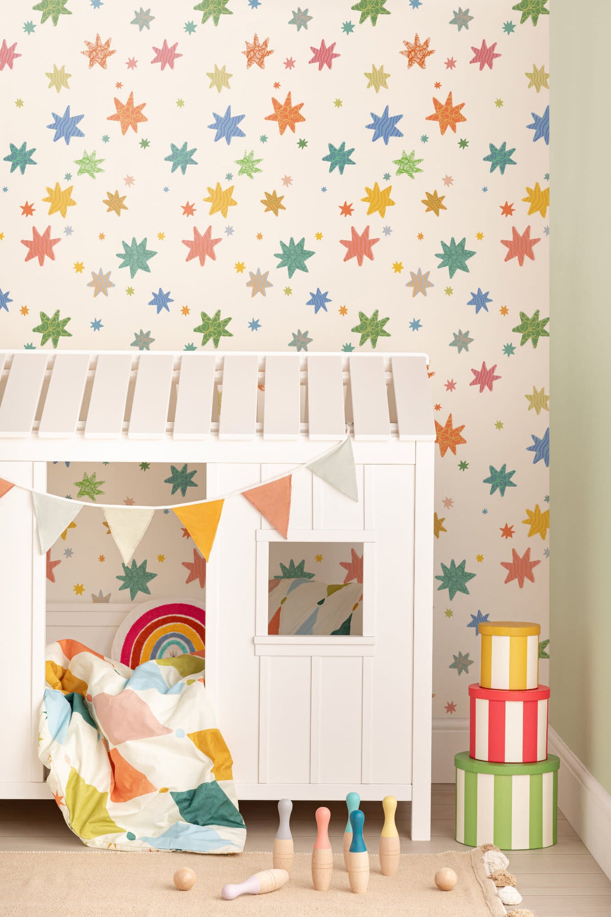 The Little Constellation wallpaper in soft white in a child's bedroom