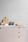 The Loft Brickwork wallpaper in chalk white behind a styled console