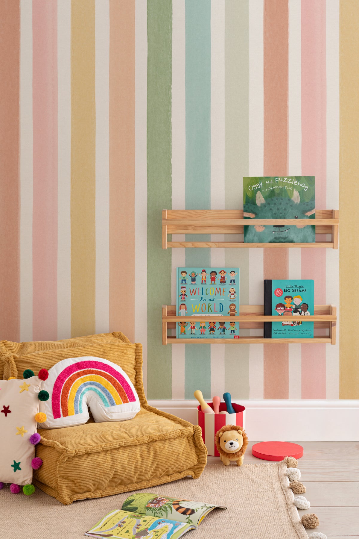 The Macaron Stripe mural in peach and mint in a child's bedroom