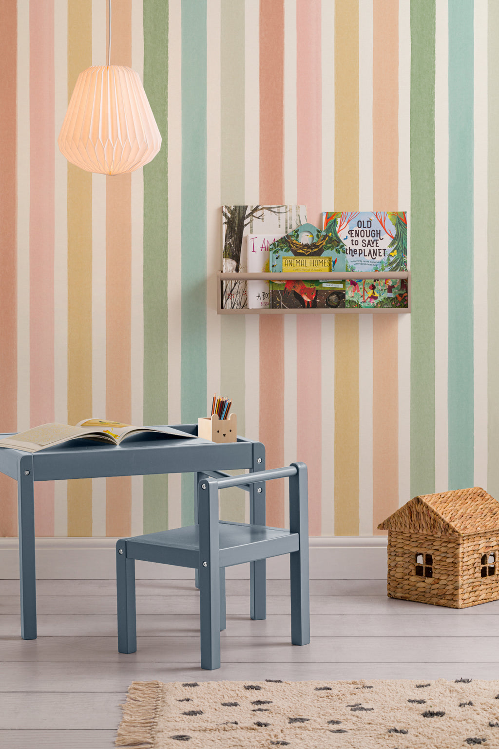 The Macaron Stripe mural in peach and mint in a children's room setting