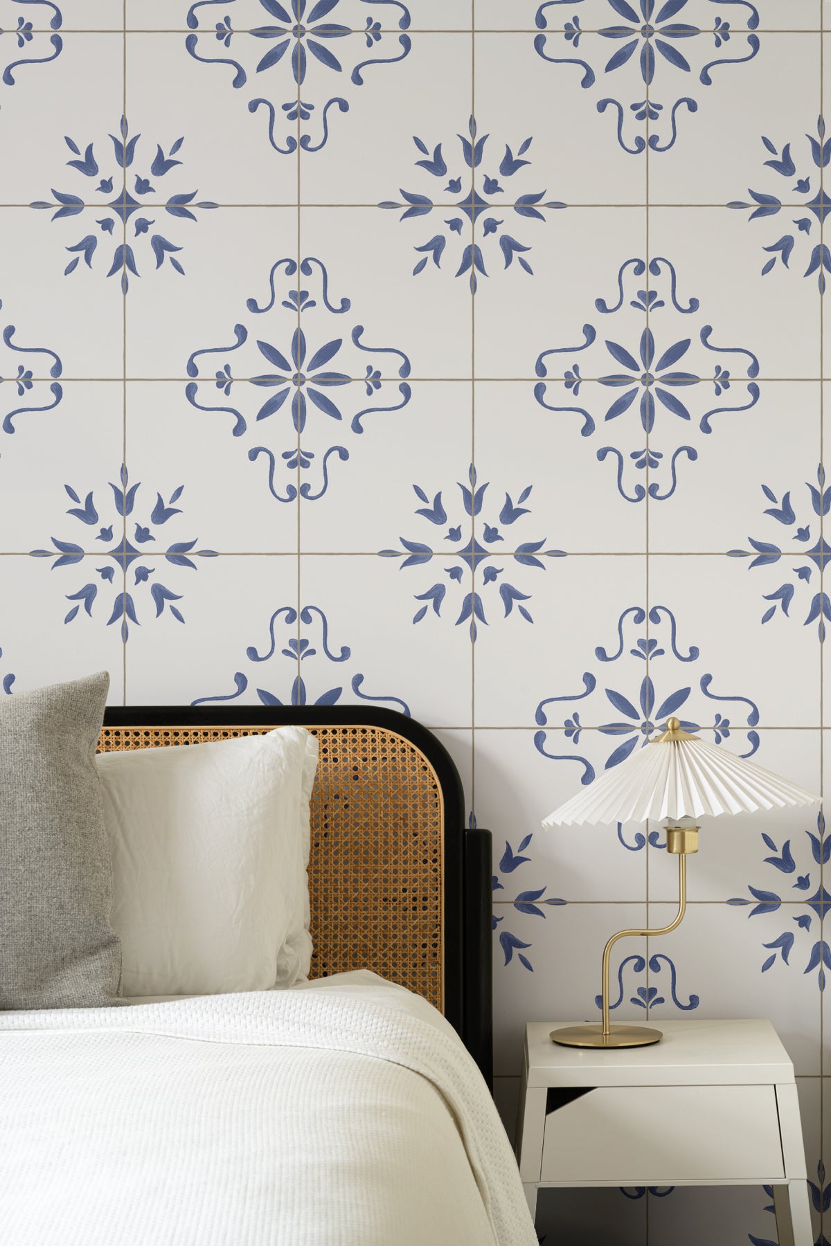 The Majolica Tile mural in cobalt and white behind the bed in a bedroom