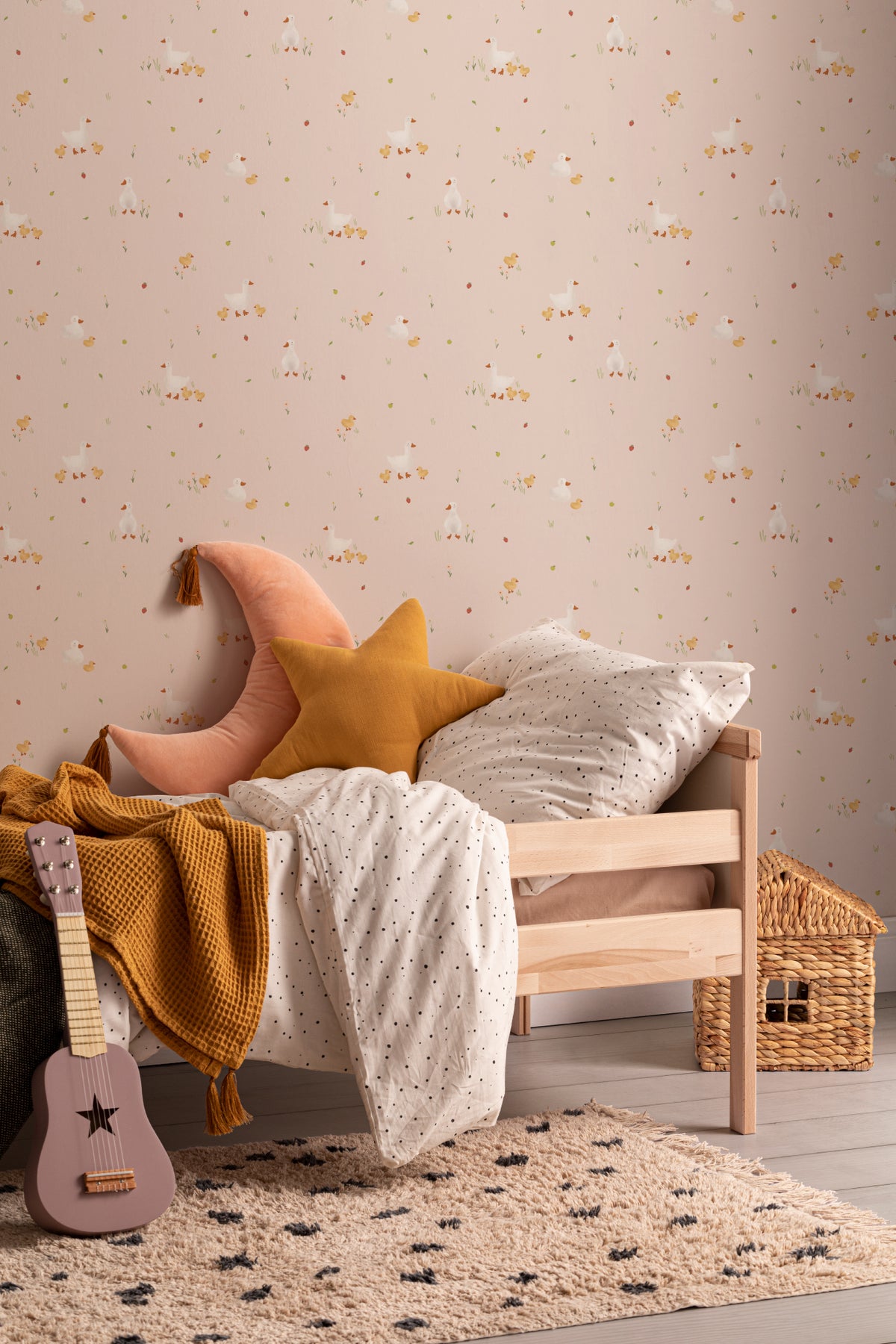 The Mallard Meadow wallpaper in shell pink in a living room