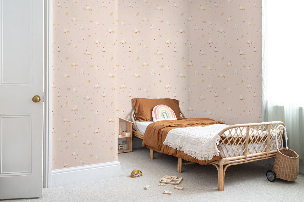 The Mallard Meadow wallpaper in shell pink on a nursery wall