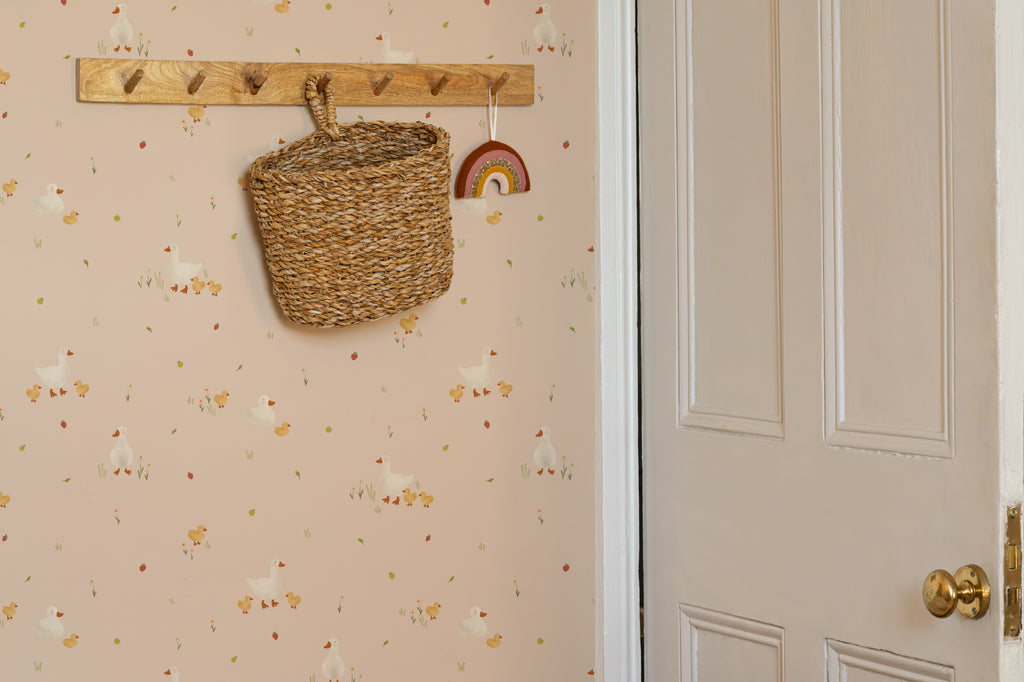 The Mallard Meadow wallpaper in shell pink in a hallway
