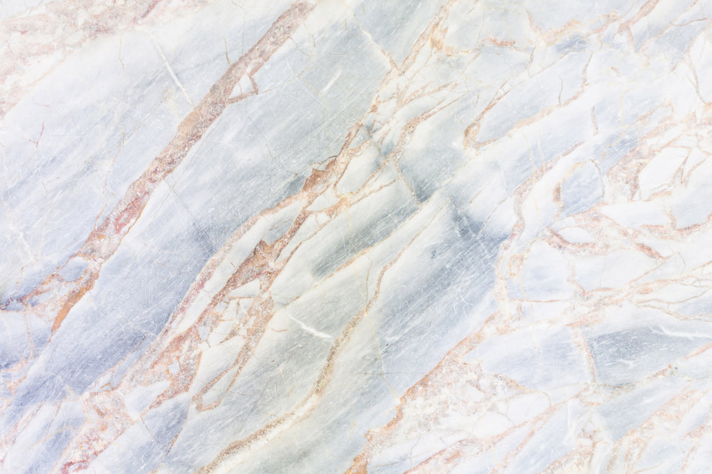 Full artwork view of The Marble Fissure mural in pale stone and bronze, showing marble with bronze fissures