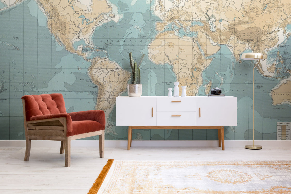 The Mariner Chart mural in sea blue and parchment in a living room