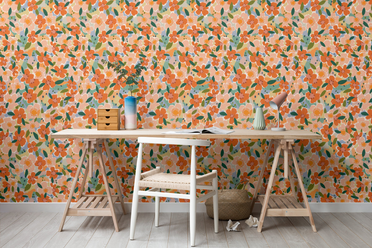 The Marmalade Bloom wallpaper in tangerine and blush behind a dining table