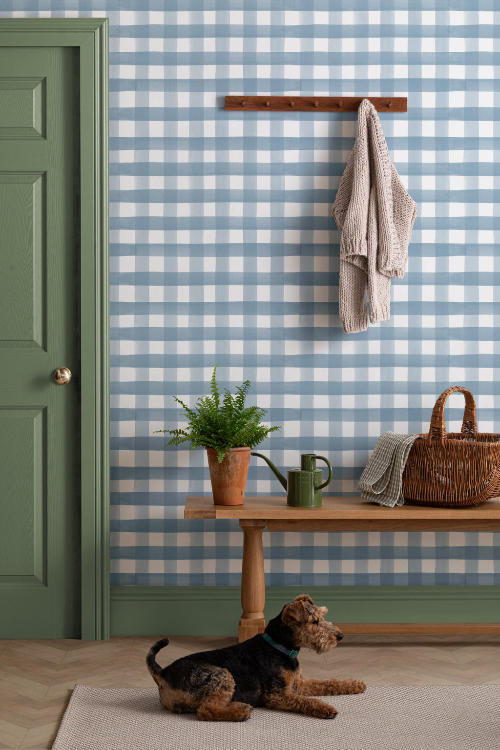The Meadow Gingham wallpaper in navy and chambray in a hallway