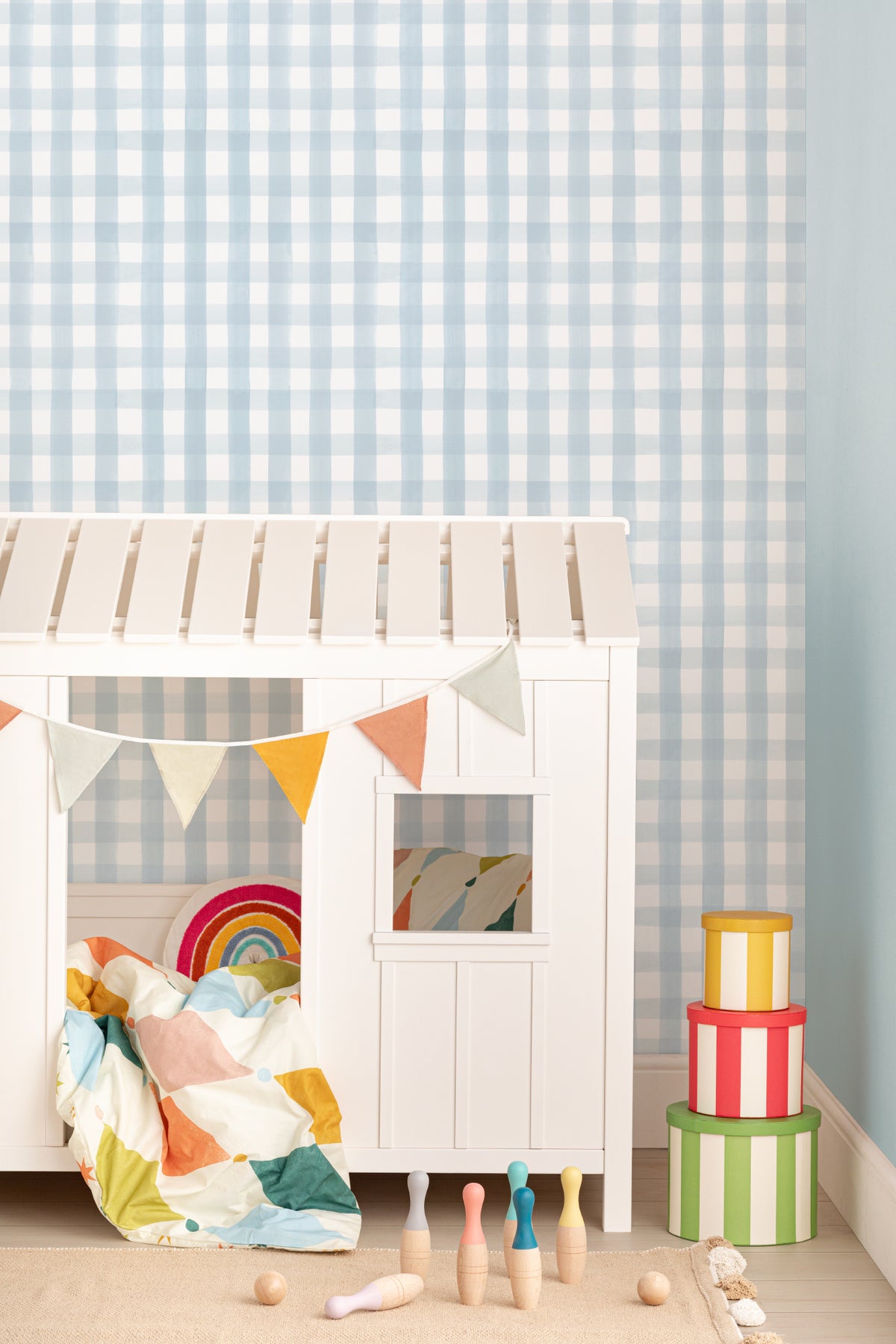 The Meadow Gingham wallpaper in powder blue in a children's room setting, another angle
