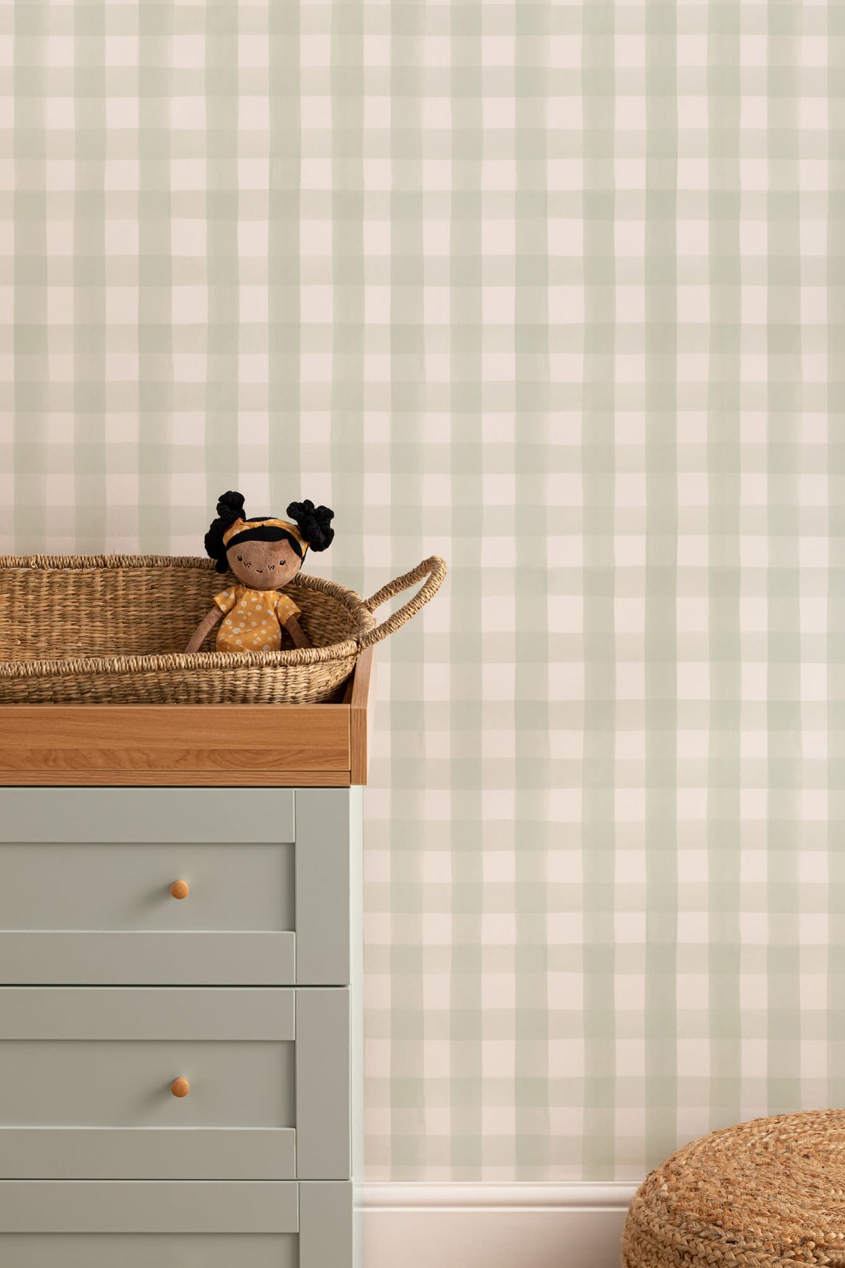 The Meadow Gingham wallpaper in sage green and white on a nursery wall