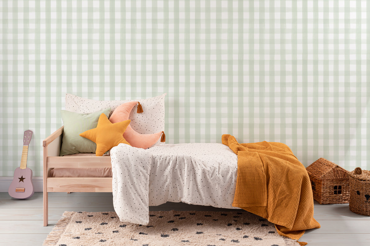 The Meadow Gingham wallpaper in sage green and white in a child's bedroom