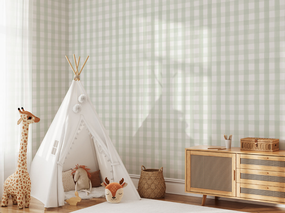 The Meadow Gingham wallpaper in sage green and white behind a kids' play corner