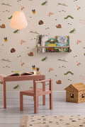 The Minibeast Garden wallpaper in soft neutral on a nursery wall