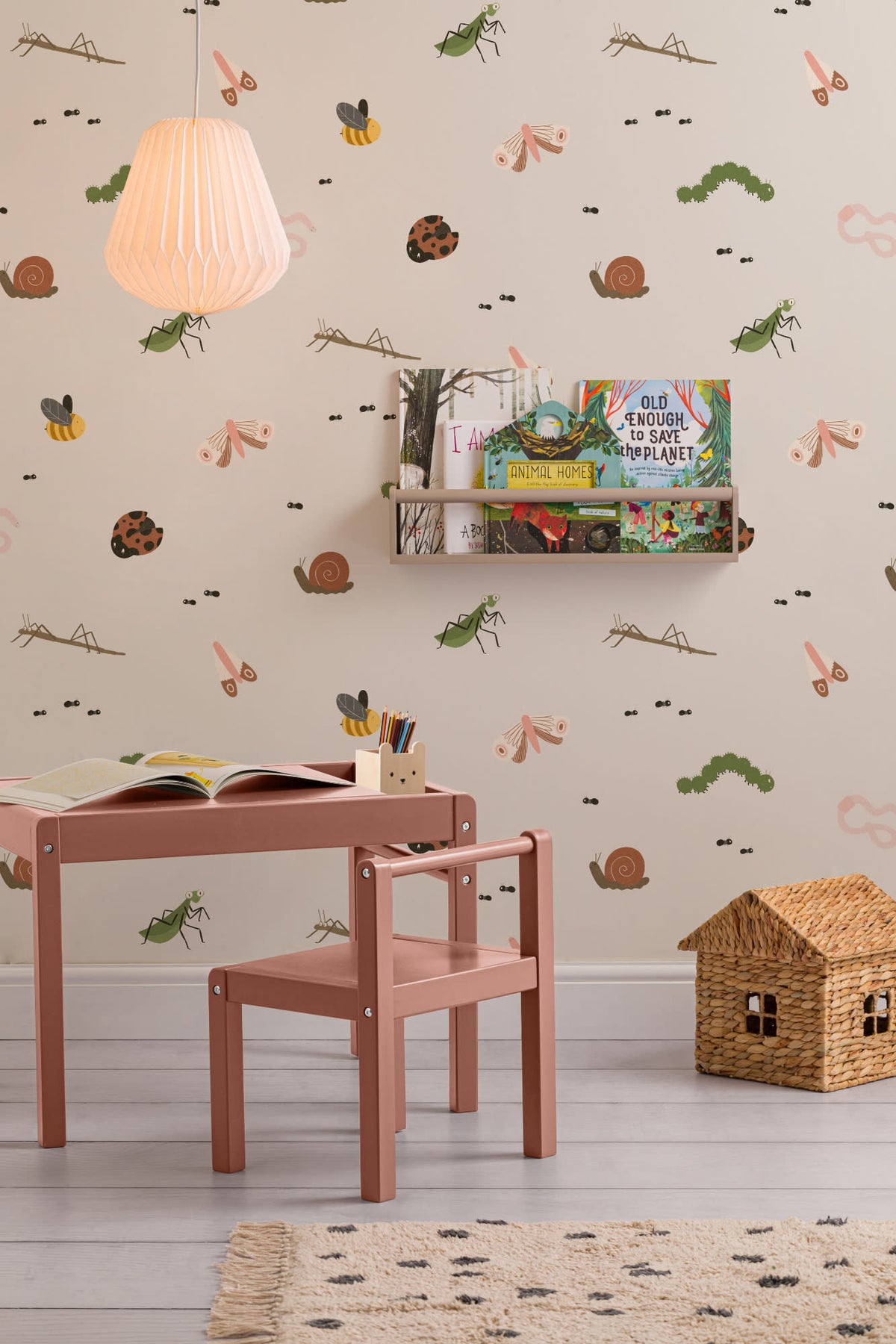 The Minibeast Garden wallpaper in soft neutral on a nursery wall