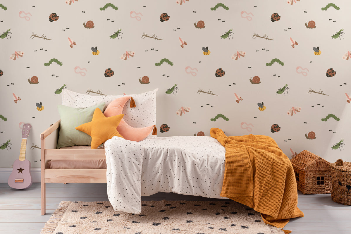 The Minibeast Garden wallpaper in soft neutral behind a kids' play corner