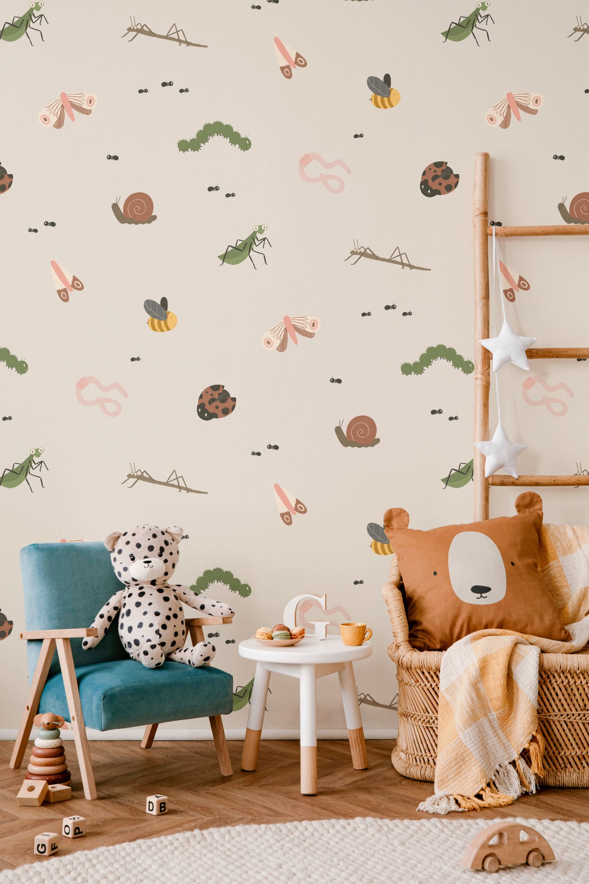 The Minibeast Garden wallpaper in soft neutral in a children's room setting, another angle