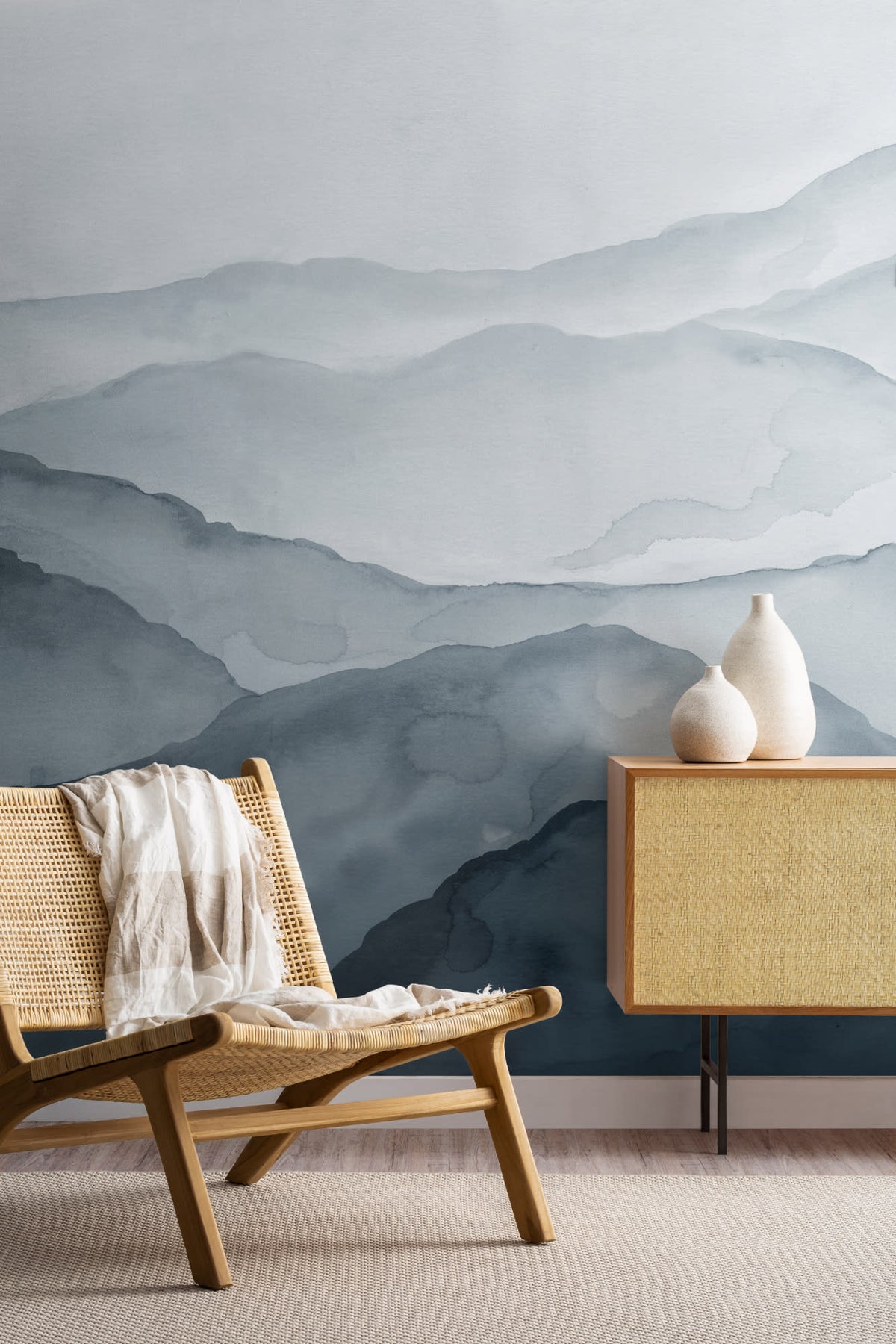 The Misted Ranges mural in ink and ice blue in a living room