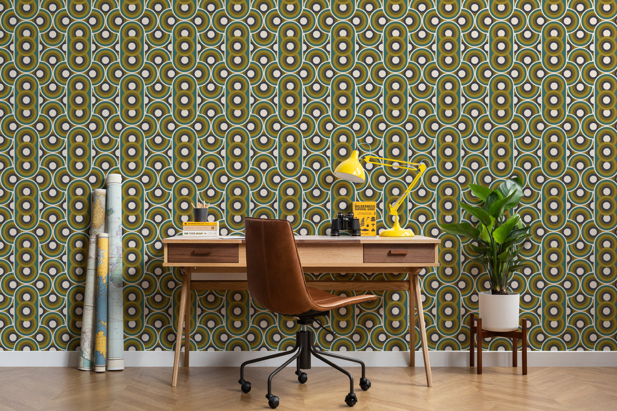 The Mod Portico wallpaper in olive and chocolate behind a desk in a home office