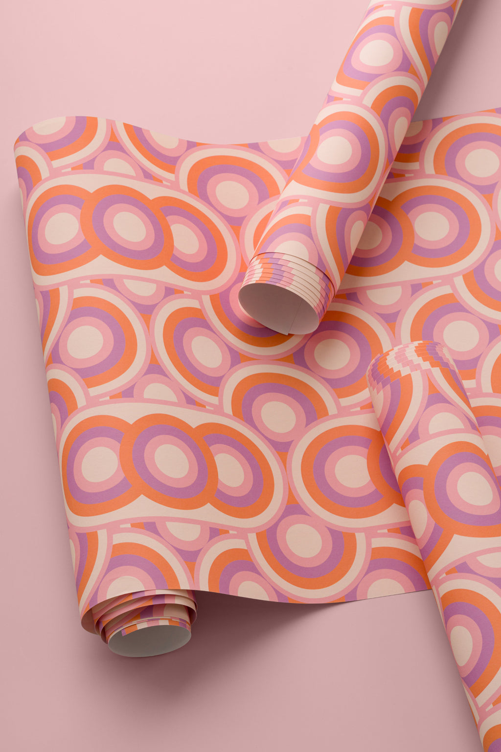 Angled detail of The Mod Portico wallpaper in tangerine and pink
