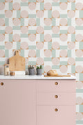 The Modernist Mosaic wallpaper in blush and sage in a child's bedroom