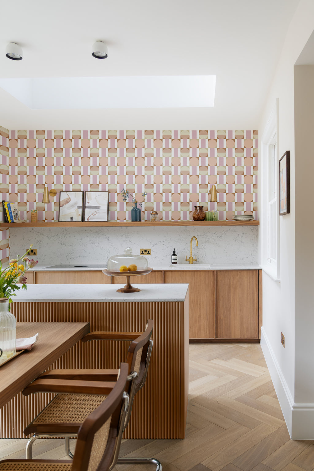 The Modernist Mosaic wallpaper in peach and rose in a kitchen