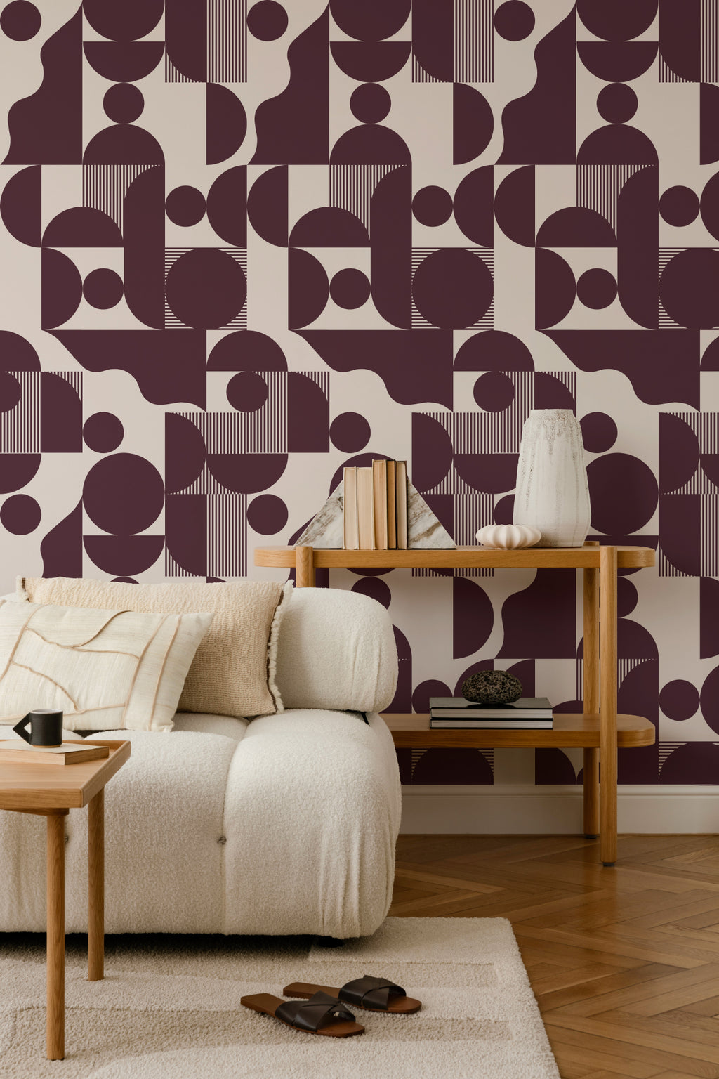 The Modernist Quadrant wallpaper in burgundy plum in a living room