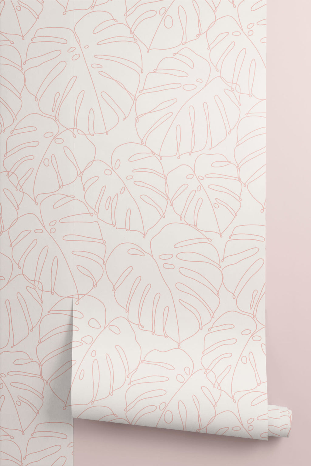 Roll of The Monstera Loggia wallpaper in blush and cream, another angle