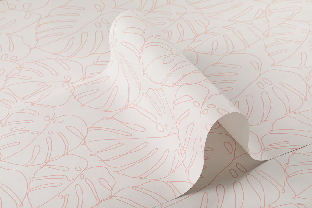 Roll of The Monstera Loggia wallpaper in blush and cream