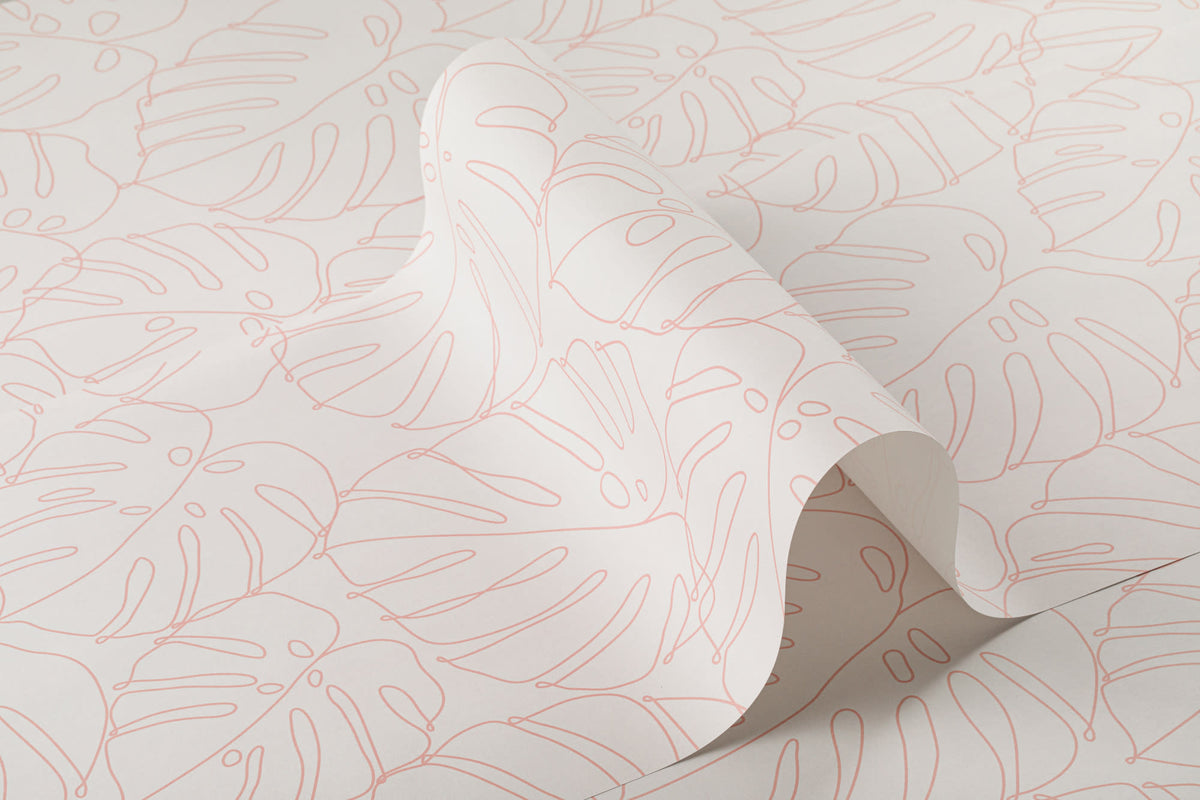 Roll of The Monstera Loggia wallpaper in blush and cream