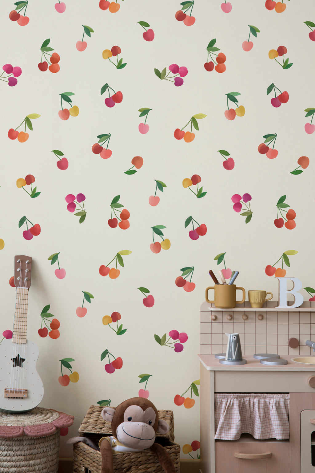 The Morello Orchard wallpaper in cherry red and cream behind a styled console