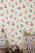 The Morello Orchard wallpaper in cherry red and cream behind a styled console