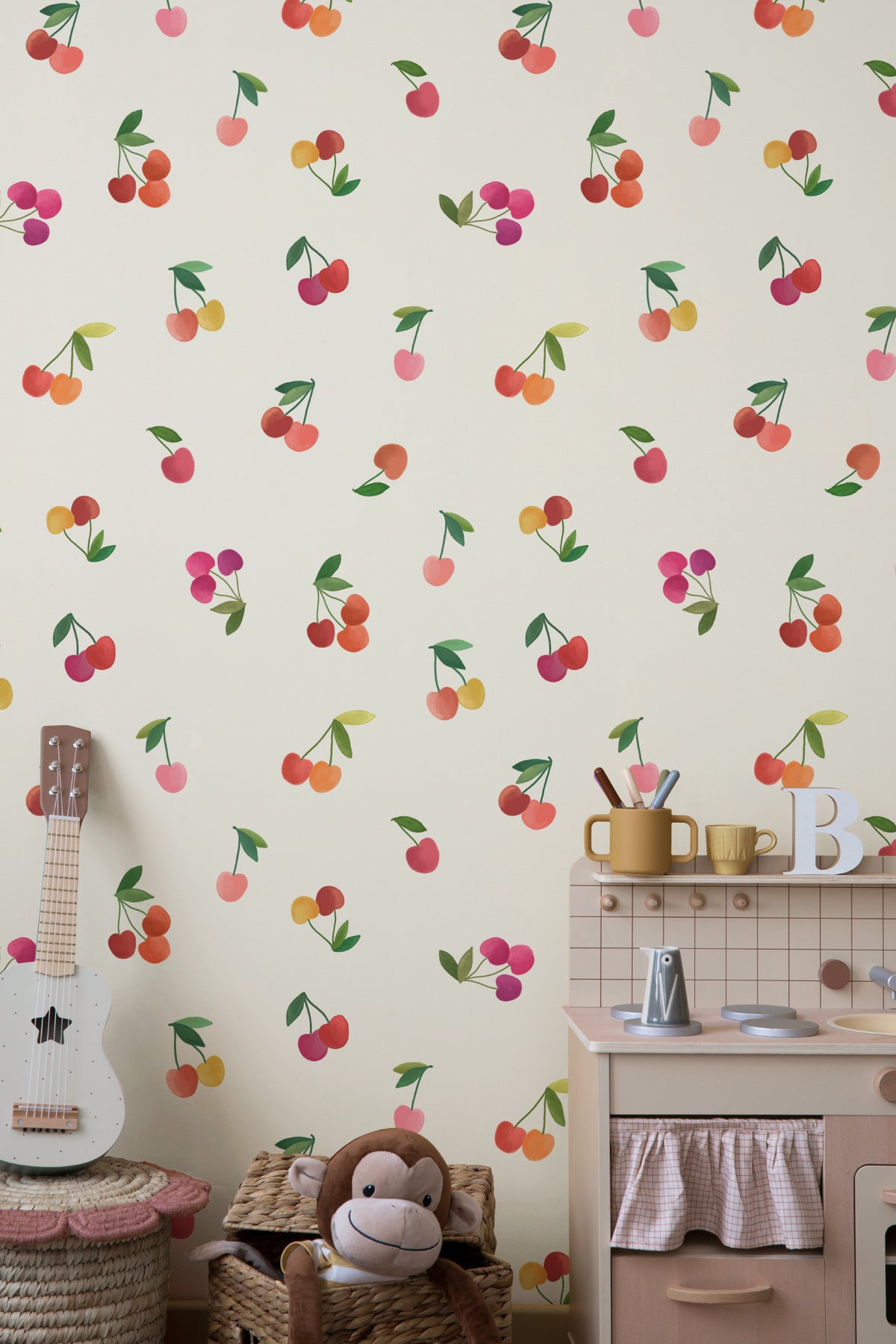 The Morello Orchard wallpaper in cherry red and cream behind a styled console