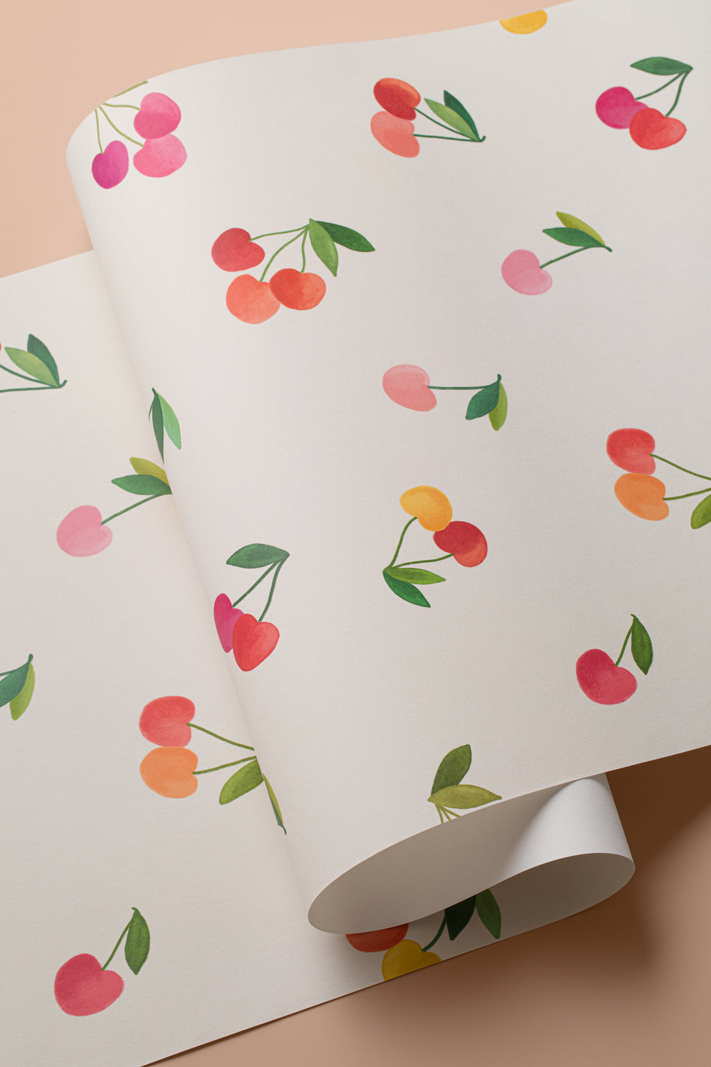 Angled detail of The Morello Orchard wallpaper in cherry red and cream