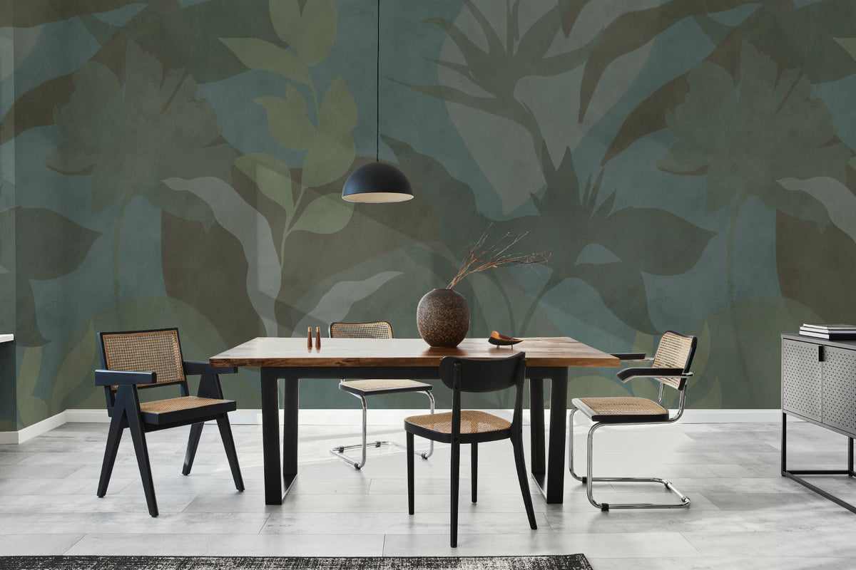 The Nocturne Fronds mural in deep teal and moss behind a desk in a home office