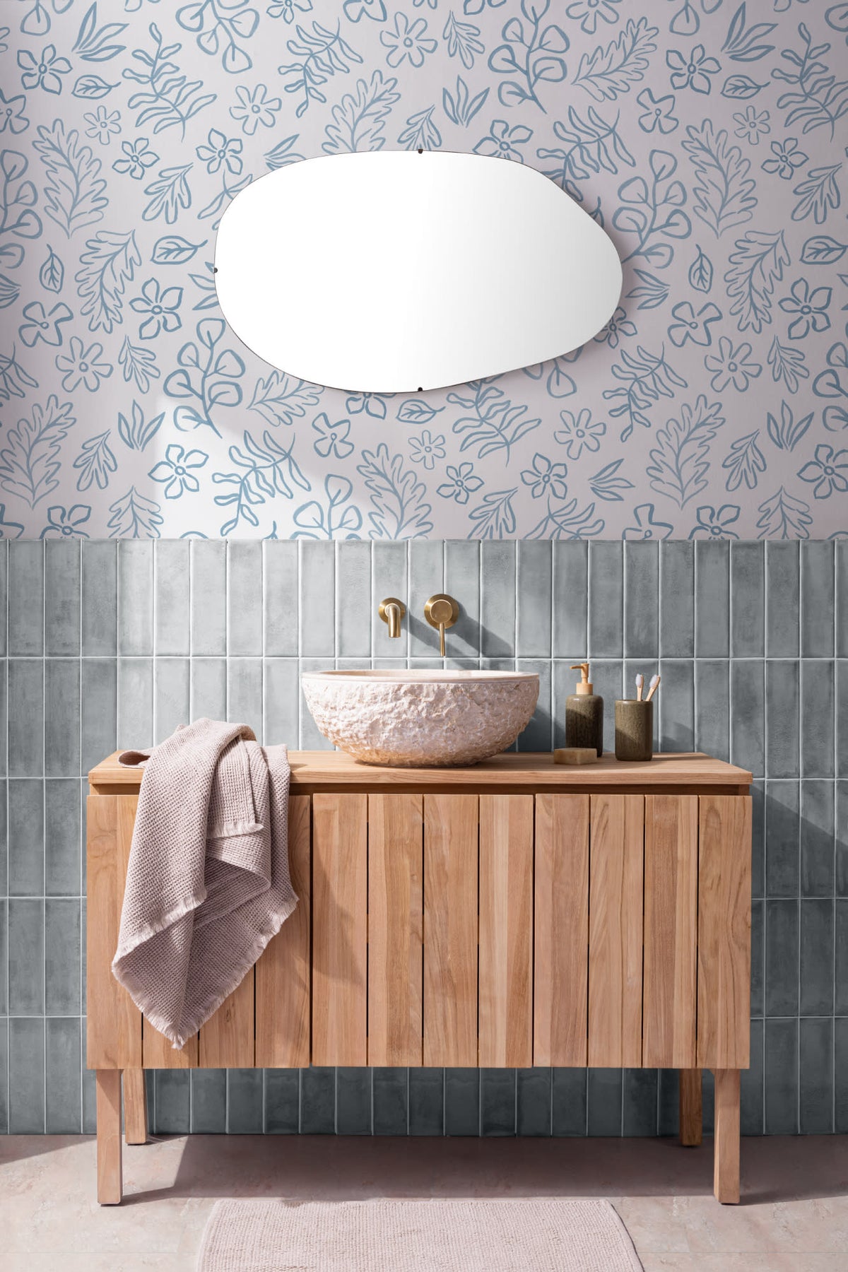 The Nordic Bough wallpaper in soft denim blue behind a styled console