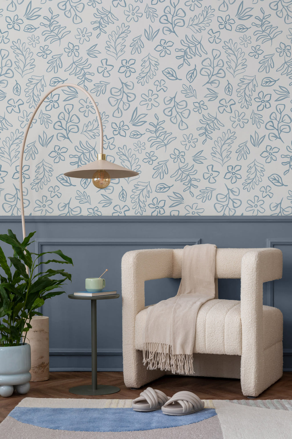 The Nordic Bough wallpaper in soft denim blue in a living room