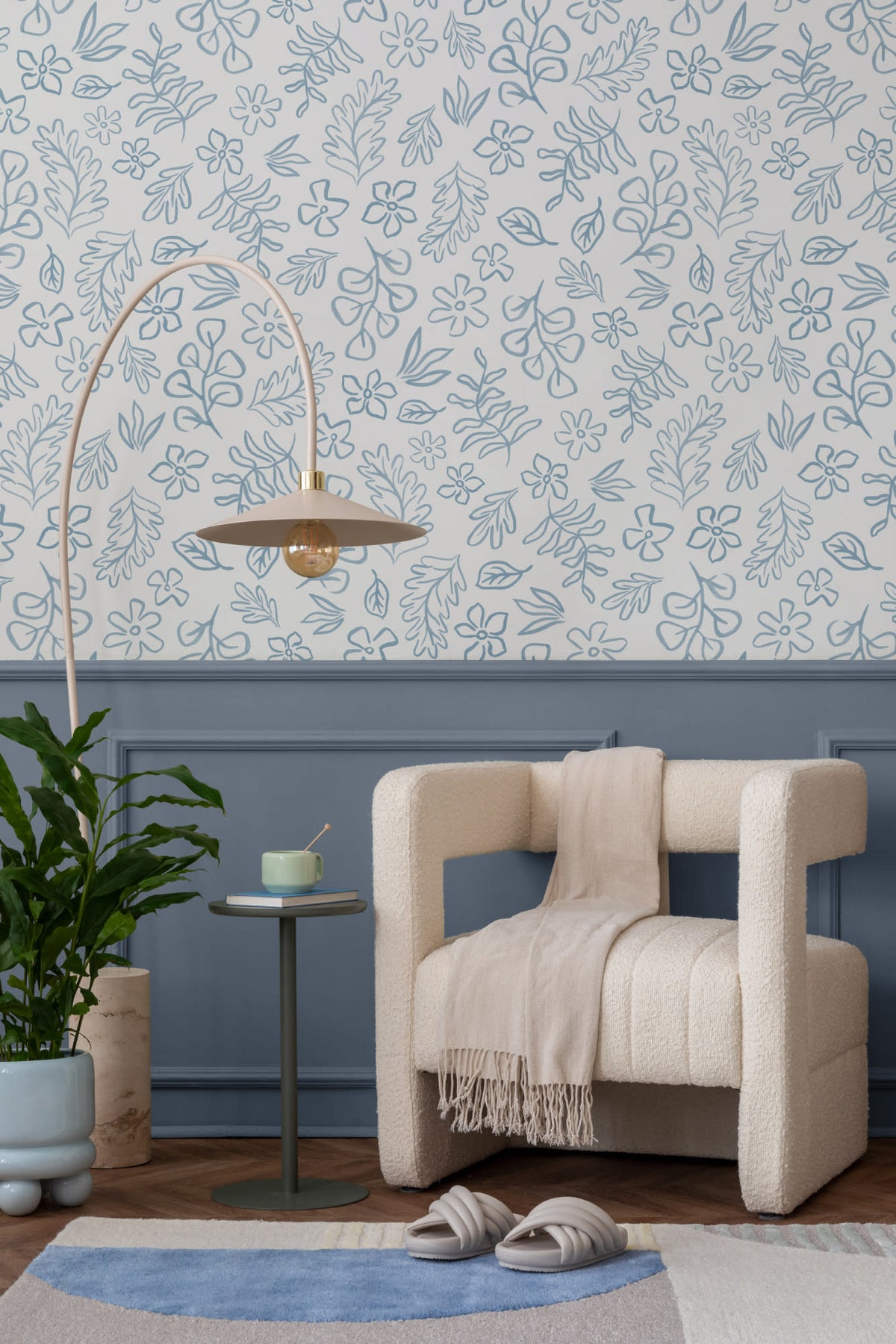 The Nordic Bough wallpaper in soft denim blue in a living room