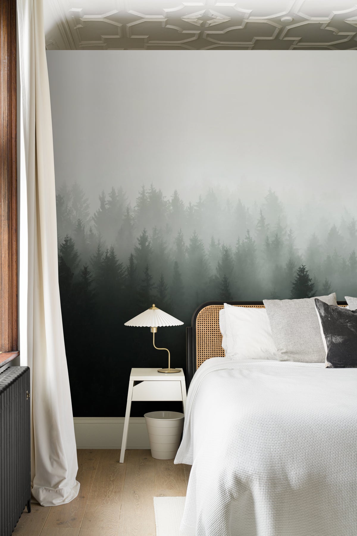 The Nordic Pinewood mural in forest green and mist white behind the bed in a bedroom
