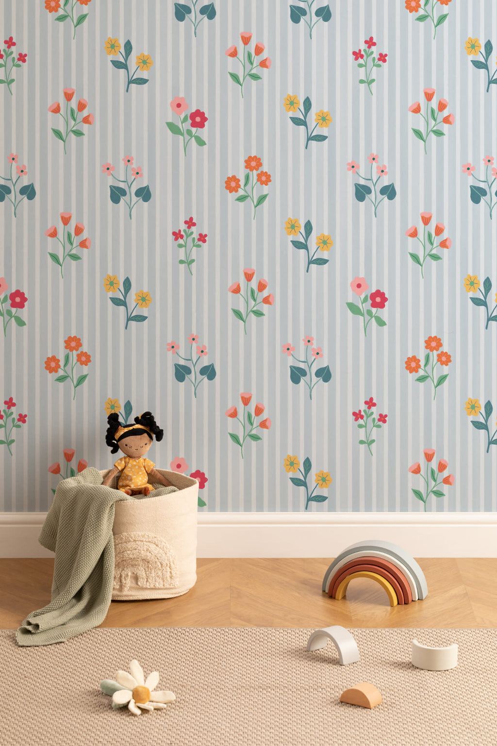 The Nosegay Stripe wallpaper in duck egg blue on a nursery wall
