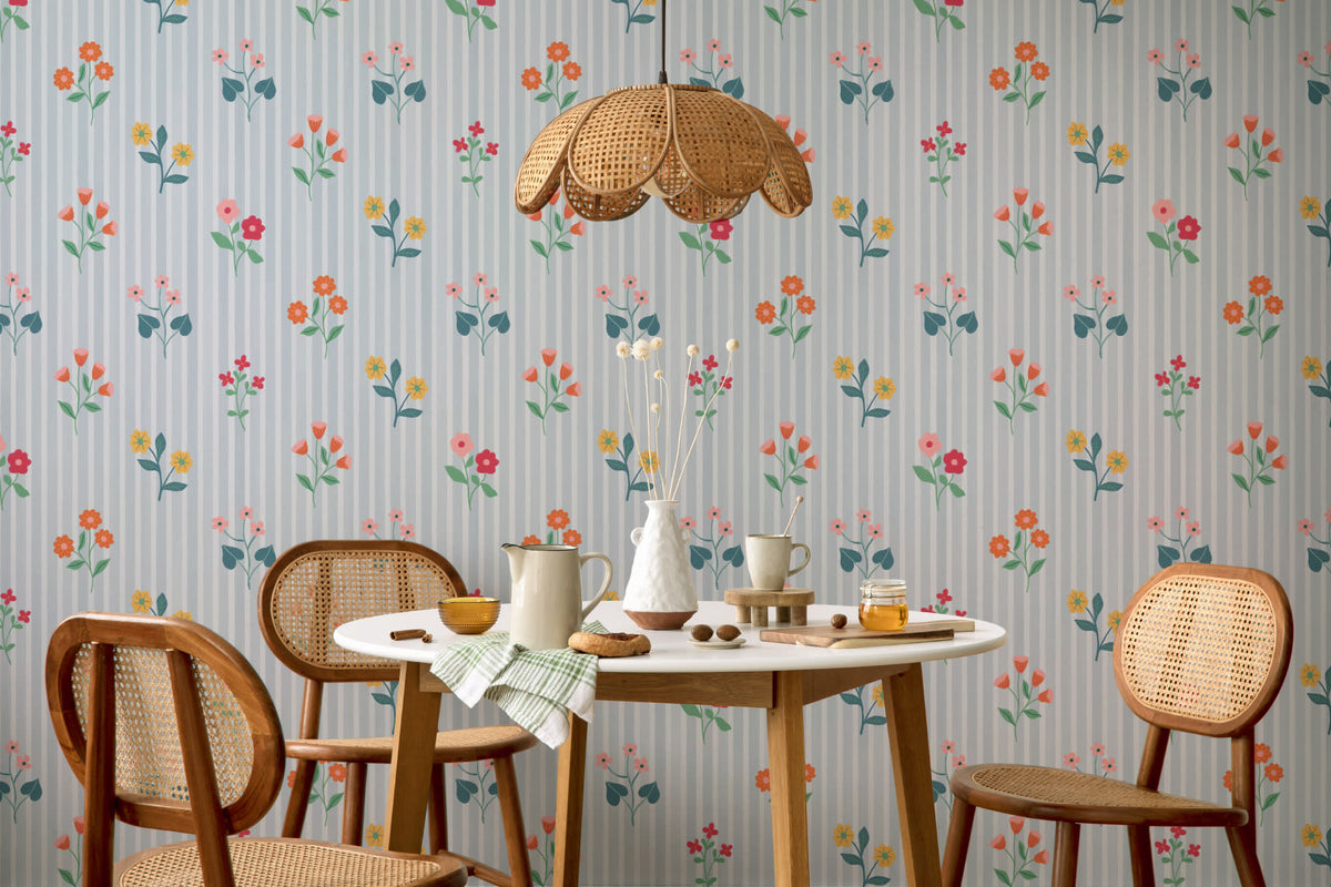The Nosegay Stripe wallpaper in duck egg blue behind a dining table