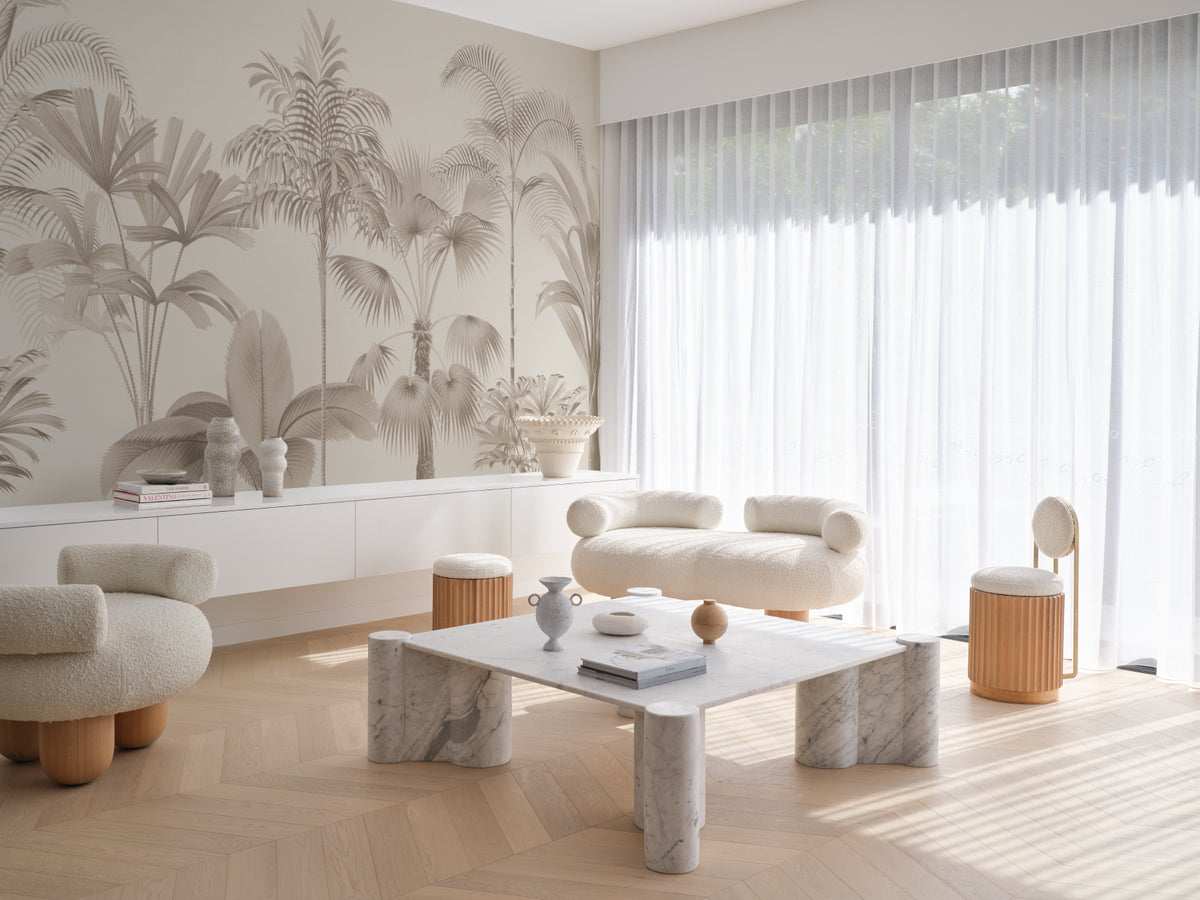 The Oasis Palms mural in sepia and sand in a lounge setting