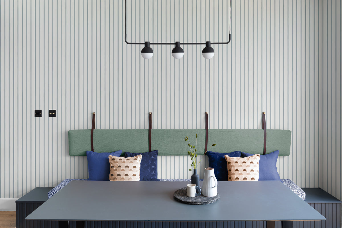 The Oxford Pinstripe mural in chambray blue in a living room