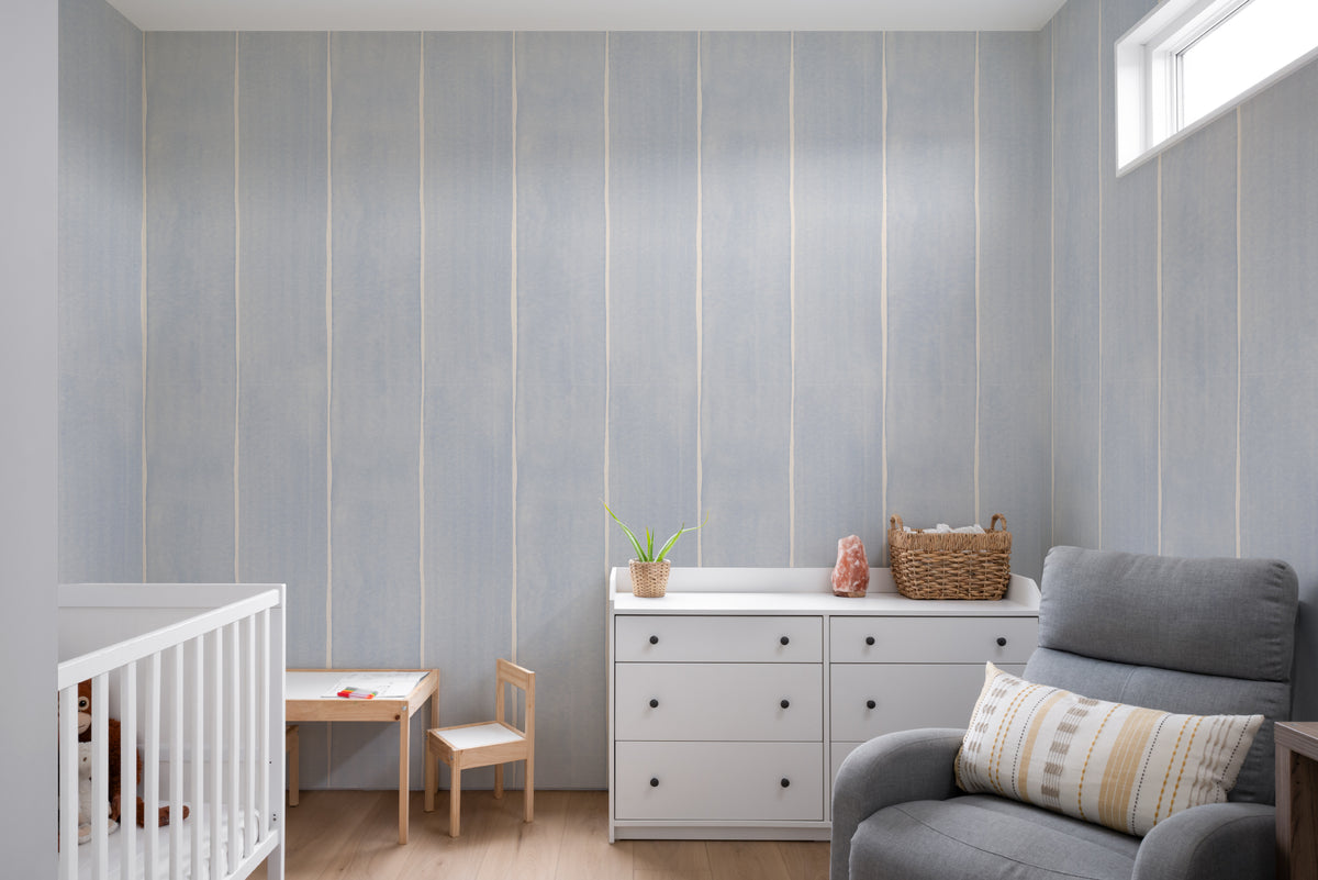 The Painted Awning wallpaper in duck egg blue on a nursery wall