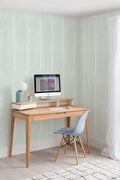 The Painted Awning wallpaper in mint sage behind a desk in a home office
