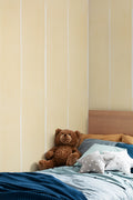 The Painted Awning wallpaper in pale primrose in a child's bedroom